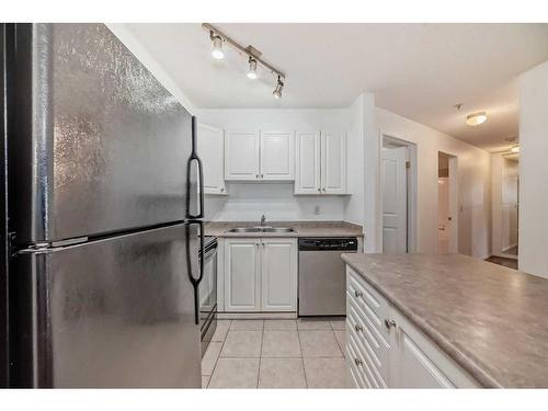 217-4000 Somervale Court Sw, Calgary, AB - Indoor Photo Showing Kitchen With Double Sink