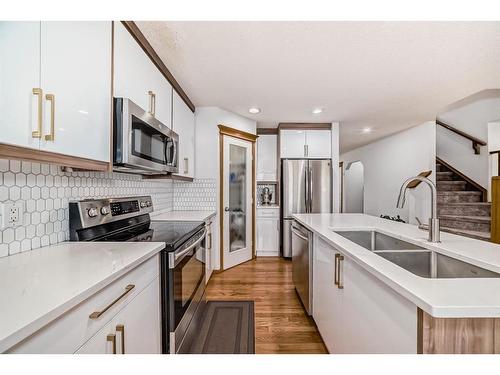 466 Bridlemeadows Common Sw, Calgary, AB - Indoor Photo Showing Kitchen With Stainless Steel Kitchen With Double Sink With Upgraded Kitchen