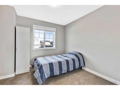 2399 Reunion Street Nw, Airdrie, AB - Indoor Photo Showing Bedroom