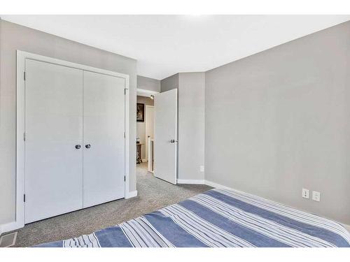 2399 Reunion Street Nw, Airdrie, AB - Indoor Photo Showing Bedroom