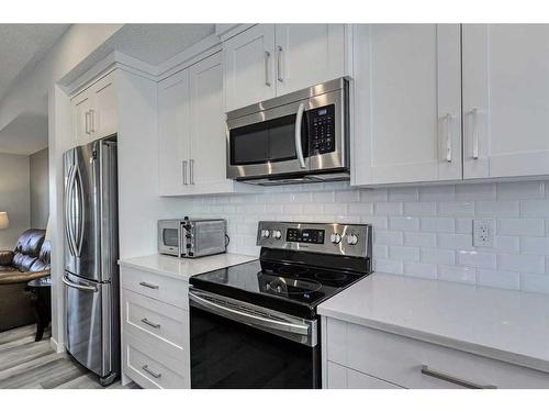 306 Harvest Grove Ne, Calgary, AB - Indoor Photo Showing Kitchen With Stainless Steel Kitchen