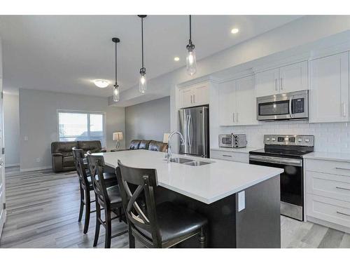 306 Harvest Grove Ne, Calgary, AB - Indoor Photo Showing Kitchen With Stainless Steel Kitchen With Double Sink With Upgraded Kitchen