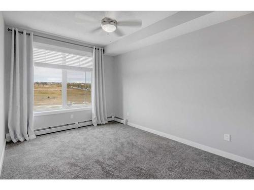 1312-3727 Sage Hill Drive Nw, Calgary, AB - Indoor Photo Showing Other Room