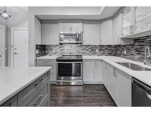 1312-3727 Sage Hill Drive Nw, Calgary, AB - Indoor Photo Showing Kitchen With Stainless Steel Kitchen With Double Sink With Upgraded Kitchen