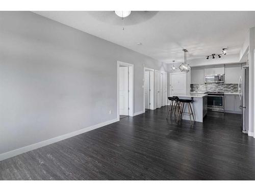 1312-3727 Sage Hill Drive Nw, Calgary, AB - Indoor Photo Showing Living Room