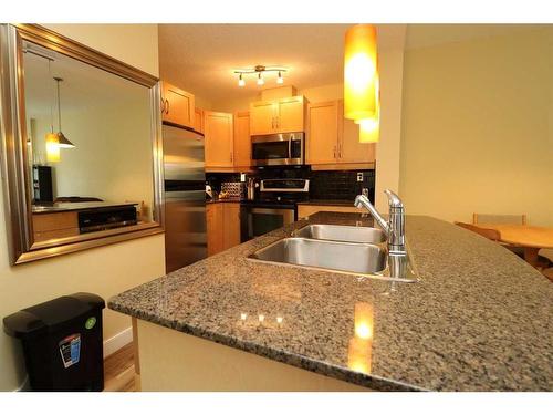 2102-5605 Henwood Street Sw, Calgary, AB - Indoor Photo Showing Kitchen With Double Sink