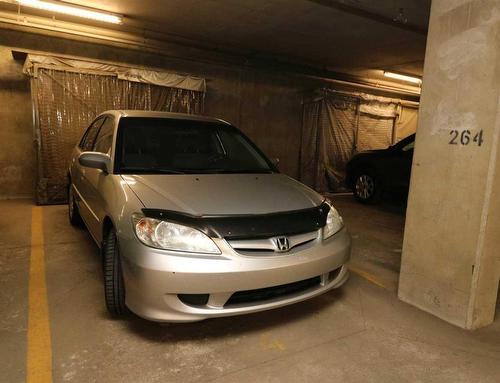 2102-5605 Henwood Street Sw, Calgary, AB - Indoor Photo Showing Garage