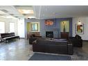 2102-5605 Henwood Street Sw, Calgary, AB  - Indoor Photo Showing Living Room With Fireplace 