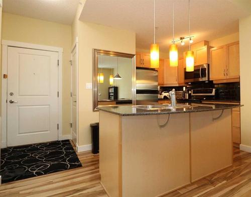 2102-5605 Henwood Street Sw, Calgary, AB - Indoor Photo Showing Kitchen With Double Sink