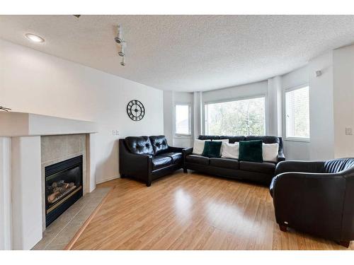 68 Hidden Ranch Crescent Nw, Calgary, AB - Indoor Photo Showing Living Room With Fireplace