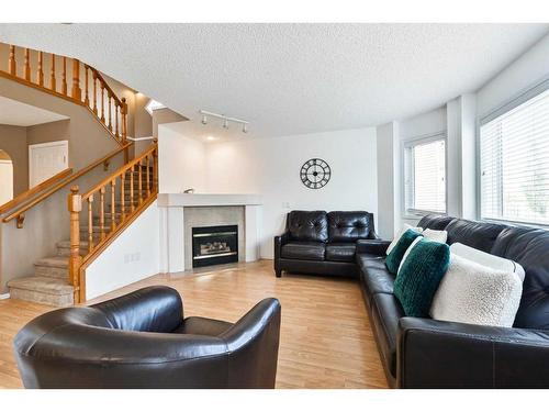 68 Hidden Ranch Crescent Nw, Calgary, AB - Indoor Photo Showing Living Room With Fireplace