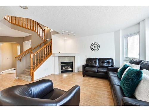 68 Hidden Ranch Crescent Nw, Calgary, AB - Indoor Photo Showing Living Room With Fireplace