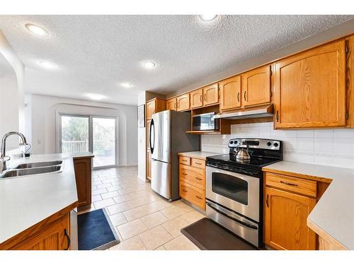 68 Hidden Ranch Crescent Nw, Calgary, AB - Indoor Photo Showing Kitchen With Stainless Steel Kitchen With Double Sink