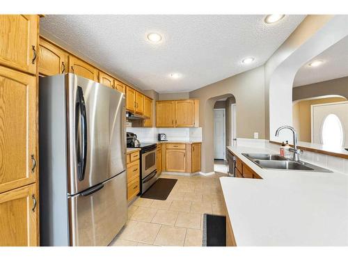 68 Hidden Ranch Crescent Nw, Calgary, AB - Indoor Photo Showing Kitchen With Stainless Steel Kitchen With Double Sink