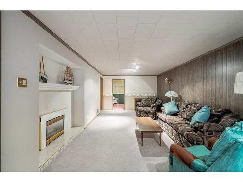 9640 Alcott Road Se, Calgary, AB - Indoor Photo Showing Living Room With Fireplace