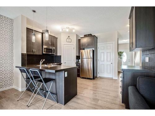 53 Copperpond Landing Se, Calgary, AB - Indoor Photo Showing Kitchen With Double Sink With Upgraded Kitchen