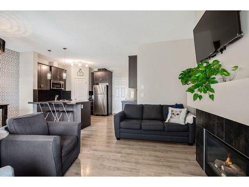 53 Copperpond Landing Se, Calgary, AB - Indoor Photo Showing Living Room With Fireplace