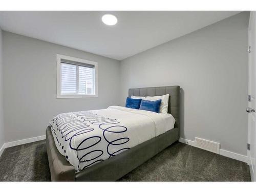 239 Hillcrest Heights Sw, Airdrie, AB - Indoor Photo Showing Bedroom