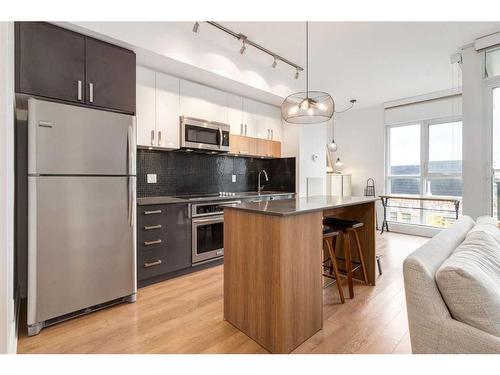 418-619 Confluence Way Se, Calgary, AB - Indoor Photo Showing Kitchen With Stainless Steel Kitchen