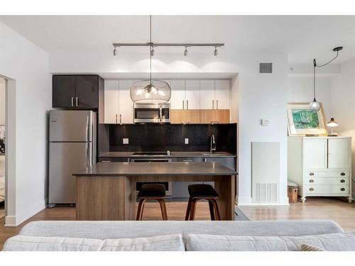 418-619 Confluence Way Se, Calgary, AB - Indoor Photo Showing Kitchen With Stainless Steel Kitchen