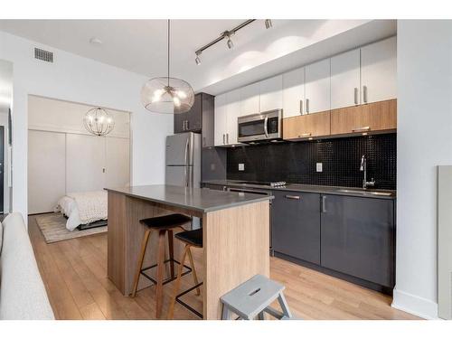 418-619 Confluence Way Se, Calgary, AB - Indoor Photo Showing Kitchen With Upgraded Kitchen