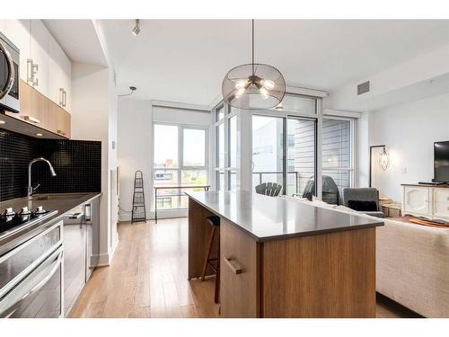 418-619 Confluence Way Se, Calgary, AB - Indoor Photo Showing Kitchen With Upgraded Kitchen