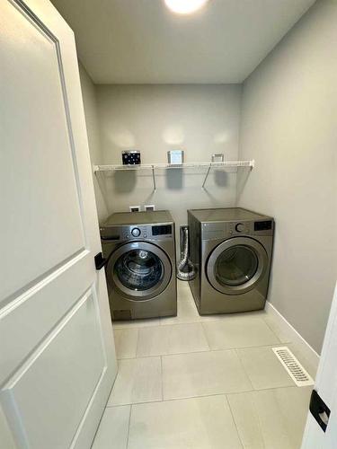 168 Arbour Lake Hill Nw, Calgary, AB - Indoor Photo Showing Laundry Room