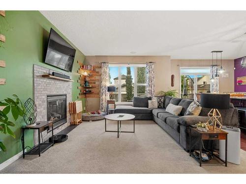 35 Copperfield Common Se, Calgary, AB - Indoor Photo Showing Living Room With Fireplace