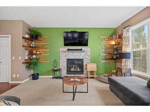 35 Copperfield Common Se, Calgary, AB - Indoor Photo Showing Living Room With Fireplace