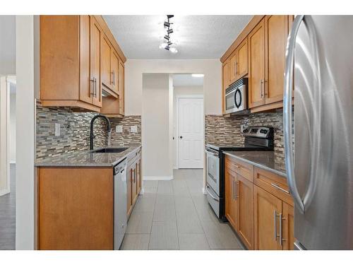 101-1513 26 Avenue Sw, Calgary, AB - Indoor Photo Showing Kitchen With Stainless Steel Kitchen With Upgraded Kitchen