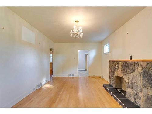 228 22 Avenue Nw, Calgary, AB - Indoor Photo Showing Other Room With Fireplace