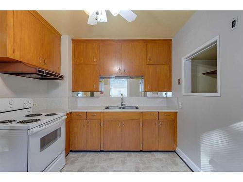 228 22 Avenue Nw, Calgary, AB - Indoor Photo Showing Kitchen With Double Sink