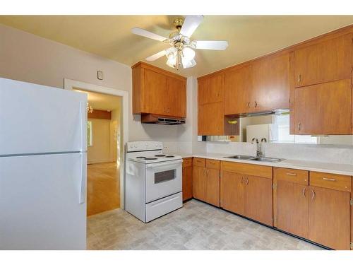 228 22 Avenue Nw, Calgary, AB - Indoor Photo Showing Kitchen With Double Sink