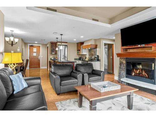 314-187 Kananaskis Way, Canmore, AB - Indoor Photo Showing Living Room With Fireplace