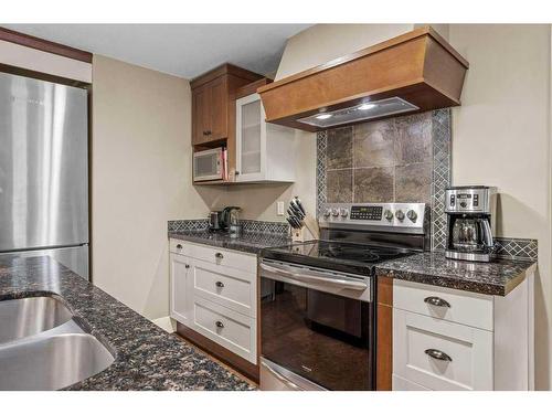 314-187 Kananaskis Way, Canmore, AB - Indoor Photo Showing Kitchen With Stainless Steel Kitchen With Double Sink