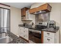 314-187 Kananaskis Way, Canmore, AB  - Indoor Photo Showing Kitchen With Stainless Steel Kitchen With Double Sink 