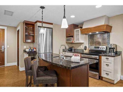 314-187 Kananaskis Way, Canmore, AB - Indoor Photo Showing Kitchen With Stainless Steel Kitchen With Double Sink