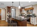 314-187 Kananaskis Way, Canmore, AB  - Indoor Photo Showing Kitchen With Stainless Steel Kitchen With Double Sink 