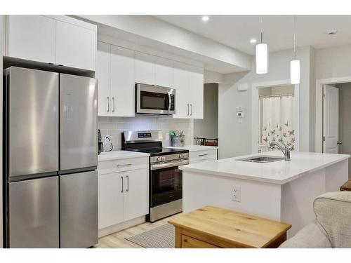 380 Canals Crossing Sw, Airdrie, AB - Indoor Photo Showing Kitchen With Upgraded Kitchen