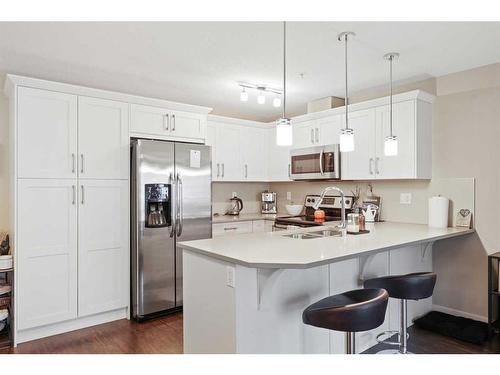 2207-450 Sage Valley Drive Nw, Calgary, AB - Indoor Photo Showing Kitchen With Upgraded Kitchen