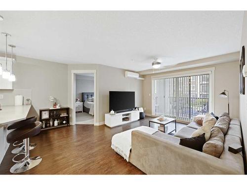 2207-450 Sage Valley Drive Nw, Calgary, AB - Indoor Photo Showing Living Room