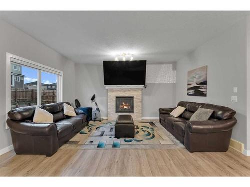 247 Kinniburgh Road, Chestermere, AB - Indoor Photo Showing Living Room With Fireplace