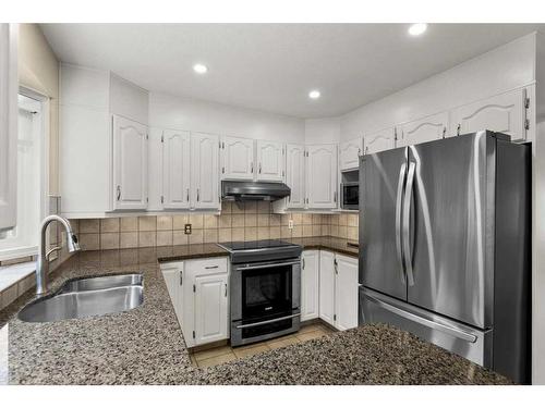 492 Silvergrove Gardens Nw, Calgary, AB - Indoor Photo Showing Kitchen With Double Sink