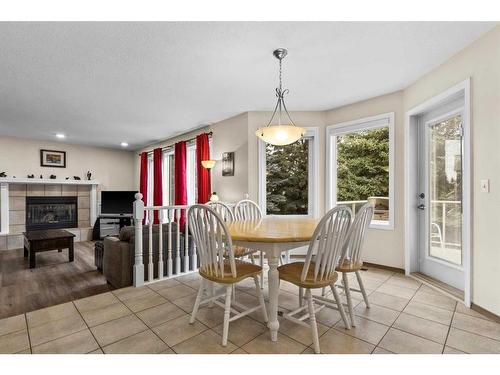 492 Silvergrove Gardens Nw, Calgary, AB - Indoor Photo Showing Dining Room With Fireplace