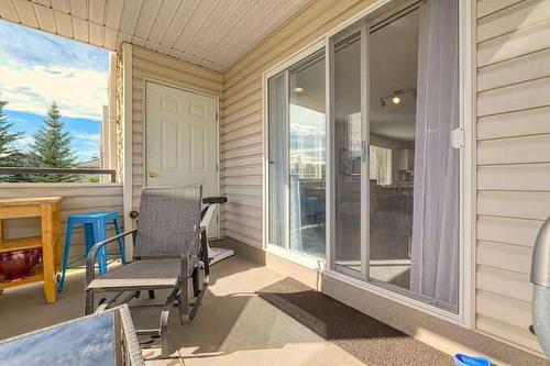 1212-7451 Springbank Boulevard Sw, Calgary, AB - Outdoor With Deck Patio Veranda With Exterior