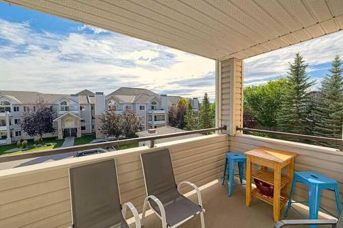 1212-7451 Springbank Boulevard Sw, Calgary, AB - Outdoor With Deck Patio Veranda With Exterior