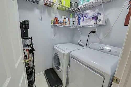 1212-7451 Springbank Boulevard Sw, Calgary, AB - Indoor Photo Showing Laundry Room