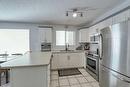 1212-7451 Springbank Boulevard Sw, Calgary, AB  - Indoor Photo Showing Kitchen With Double Sink 