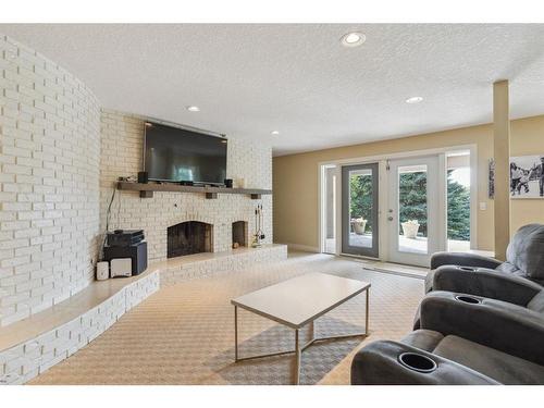 39 Anatapi Lane Sw, Calgary, AB - Indoor Photo Showing Living Room With Fireplace