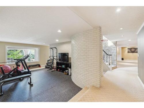 39 Anatapi Lane Sw, Calgary, AB - Indoor Photo Showing Gym Room